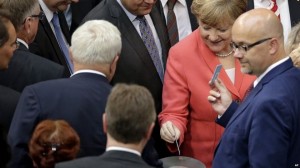  The vote gives Mrs Merkel the green light to negotiate a third bailout 