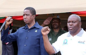 PRESIDENT Lungu (left) with Patriotic Front candidate for Malambo Jacob Shuma singing the national