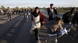  On Monday, migrants were moving along the motorway to Budapest which was later closed by police 