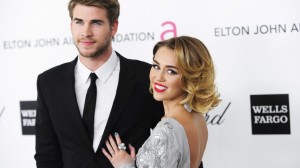  Singer Miley Cyrus (R) and actor Liam Hemsworth arrive at the 20th annual Elton John AIDS Foundation Academy Awards Viewing Party in West Hollywood, California February 26, 2012. (Reuters) 