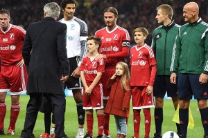 Harper Beckham's attention appeared to be elsewhere when she appeared on the pitch at the Unicef charity football match [Martin Rickett/PA Wire]