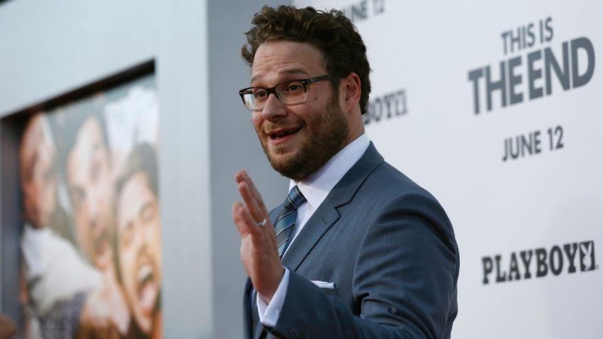  Director, writer and cast member Seth Rogen waves at the premiere of "This Is the End" at the Regency Village Theatre in Los Angeles, California June 3, 2013.  (Reuters) 