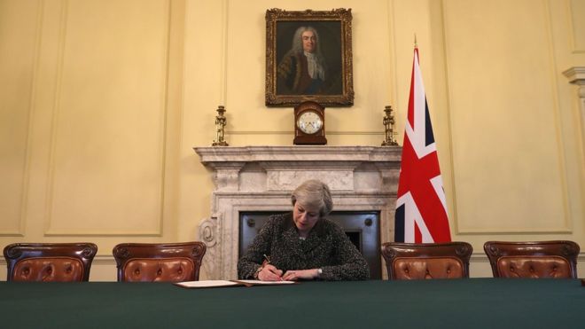  Theresa May signs the letter to the EU confirming the UK's departure 