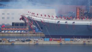 Chinese state media released a picture of the launch showing the carrier bedecked in giant colourful streamers 