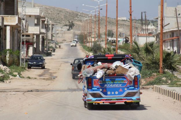  Residents could be seen leaving Khan Sheikhoun on Friday, AFP reports 