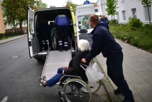 Elderly people are moved out of a care home in the evacuation zone 